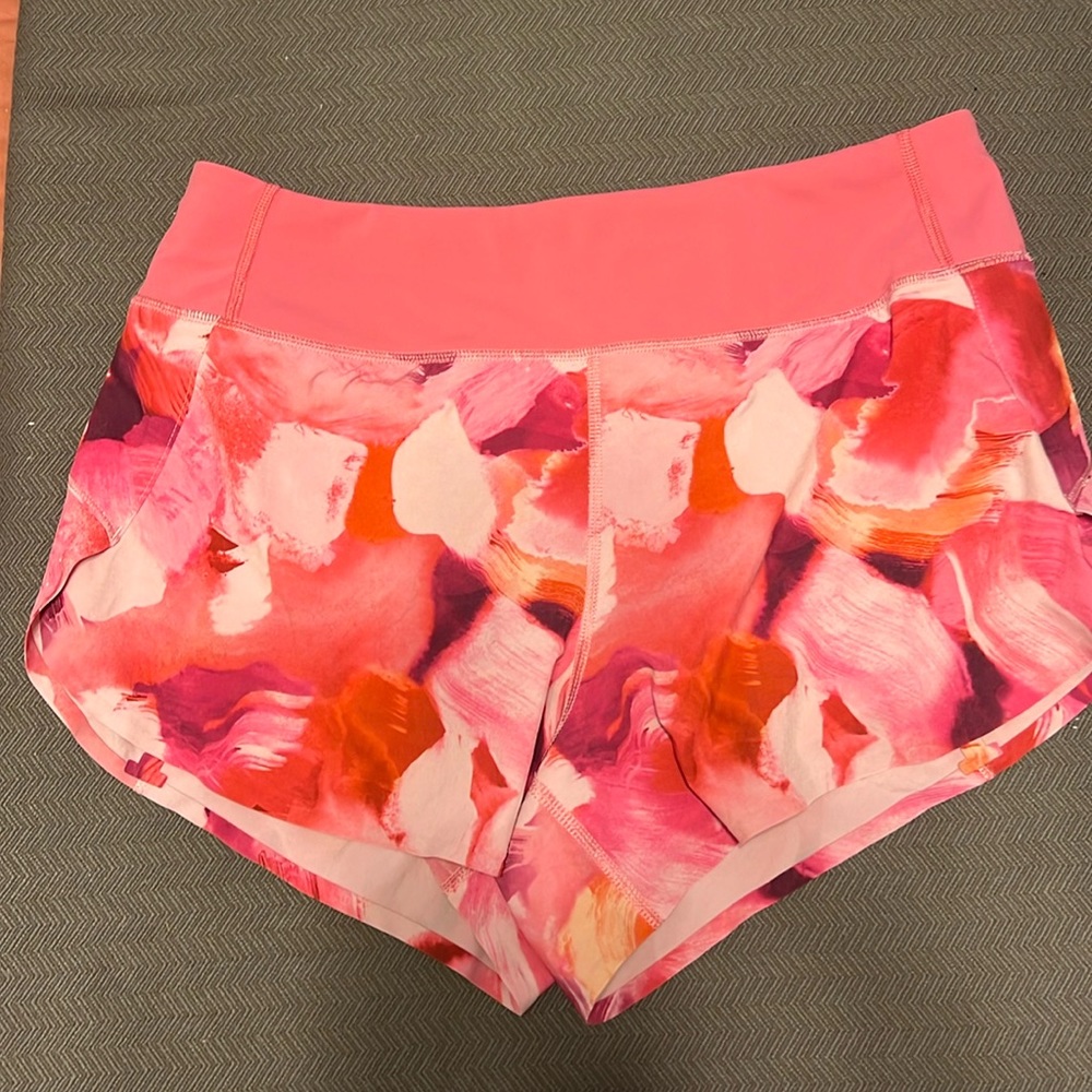 Athleta pink floral run with it  3.5 Inseam running shorts, size Small